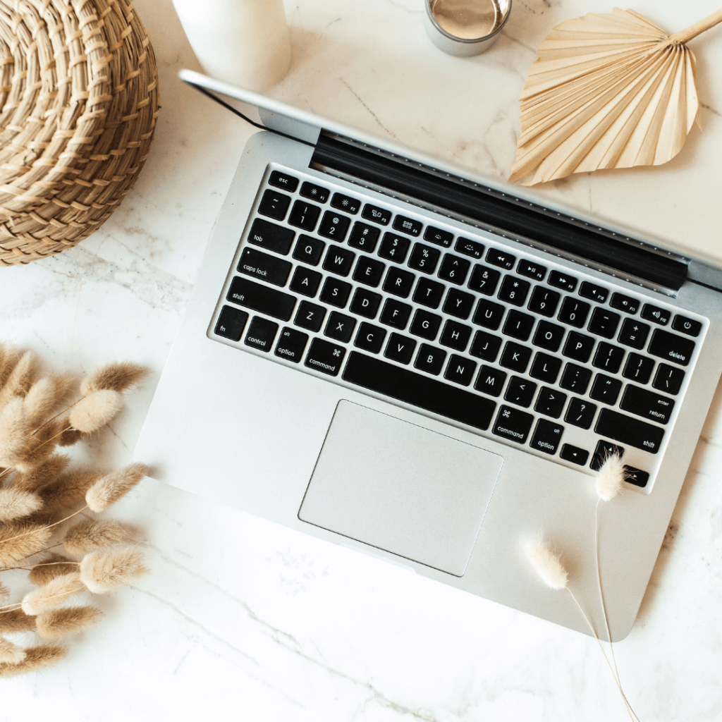 Laptop in a clean and aesthetic workspace.