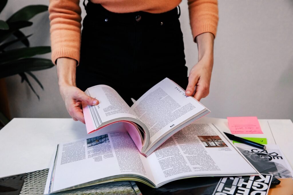 woman in office holding an opened book