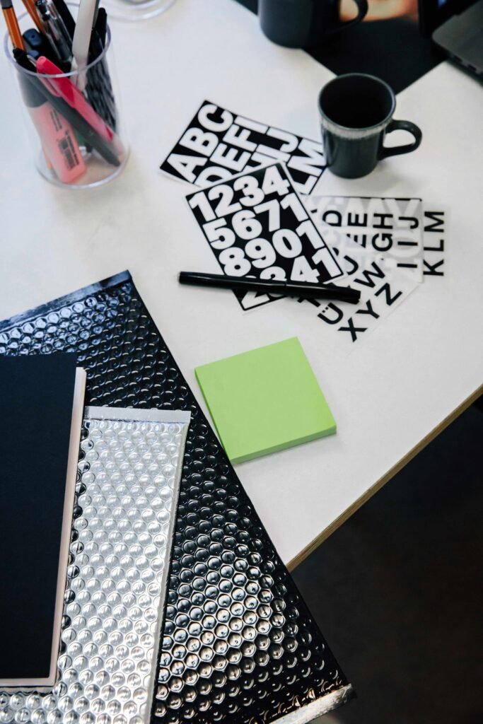 desk with pen, notepad and files