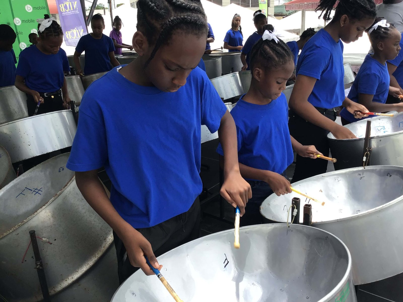 primary school steelband players performing at pan for blue event