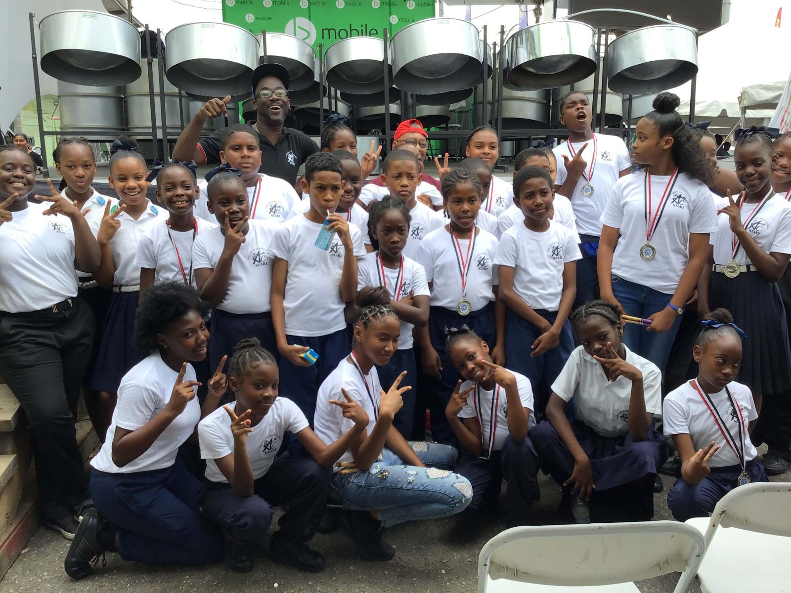 pan for blue primary school steelband players with medals