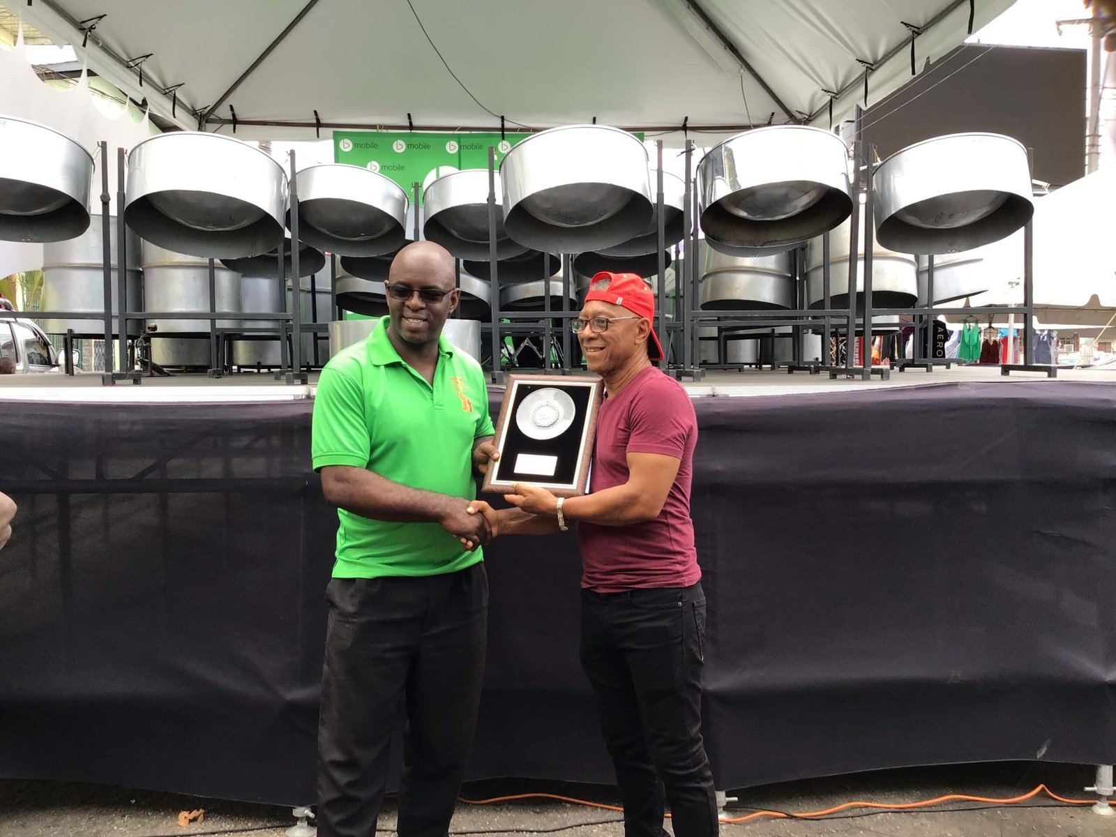 Calypsonian Cro Cro, receiving award at the pan for blue primary school steelband event