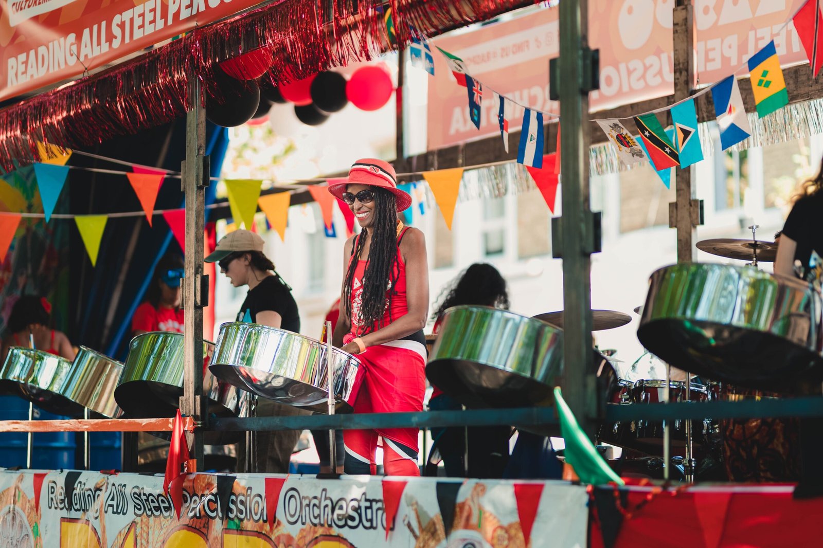 Colorful steel band performance at a carnival in London, featuring musicians in vibrant attire enhancing the festive atmosphere.
