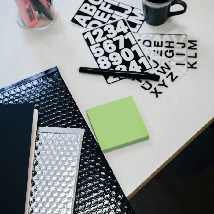 Desk workspace with pen and sticky notepad