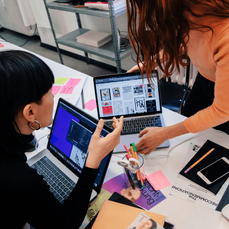 women collaborating on work project, workspace.